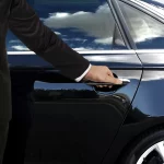 Man with black car