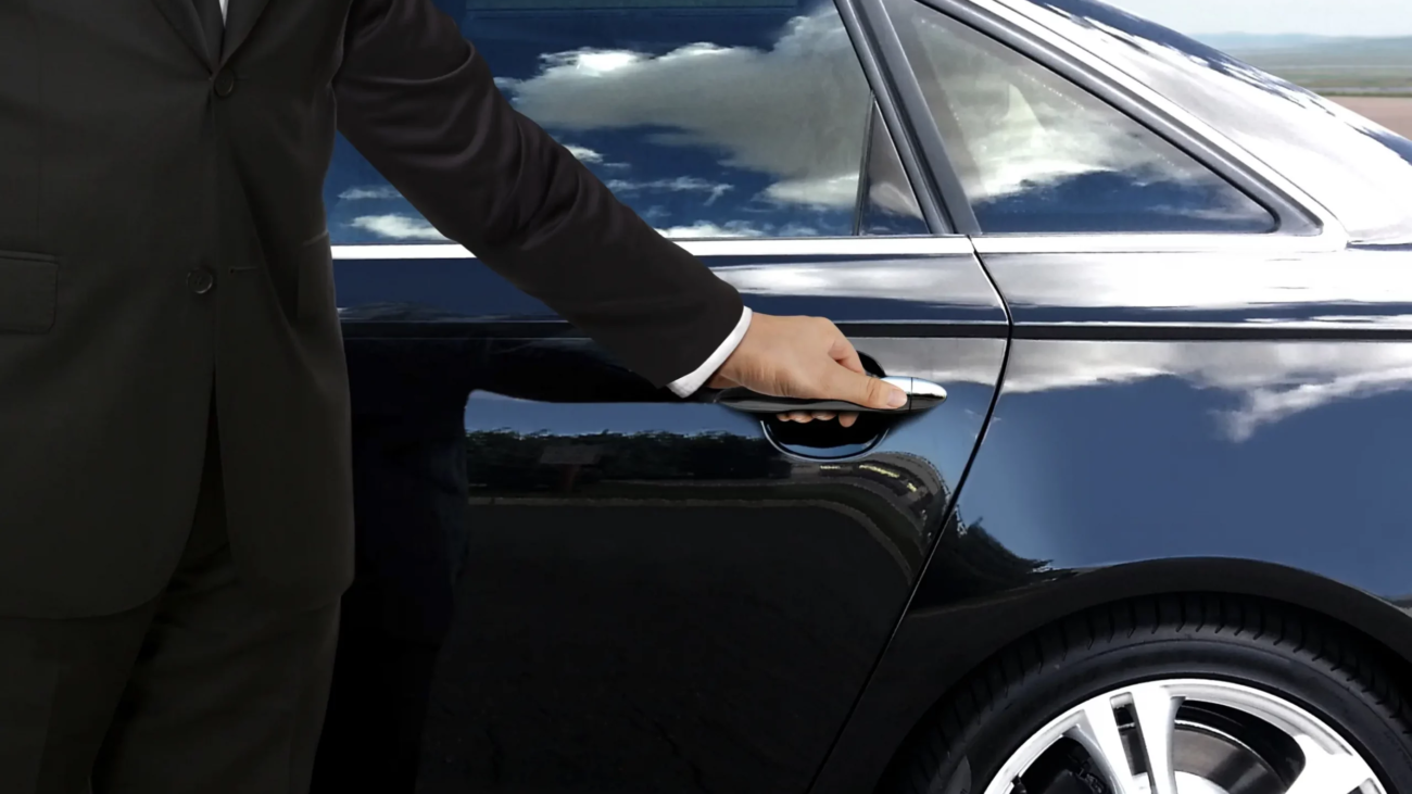 Man with black car